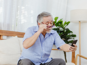 Man reading text on his phone