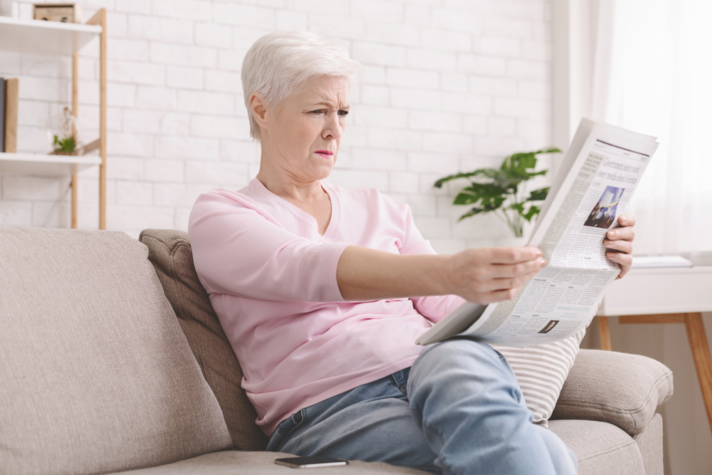 woman reading newspaper