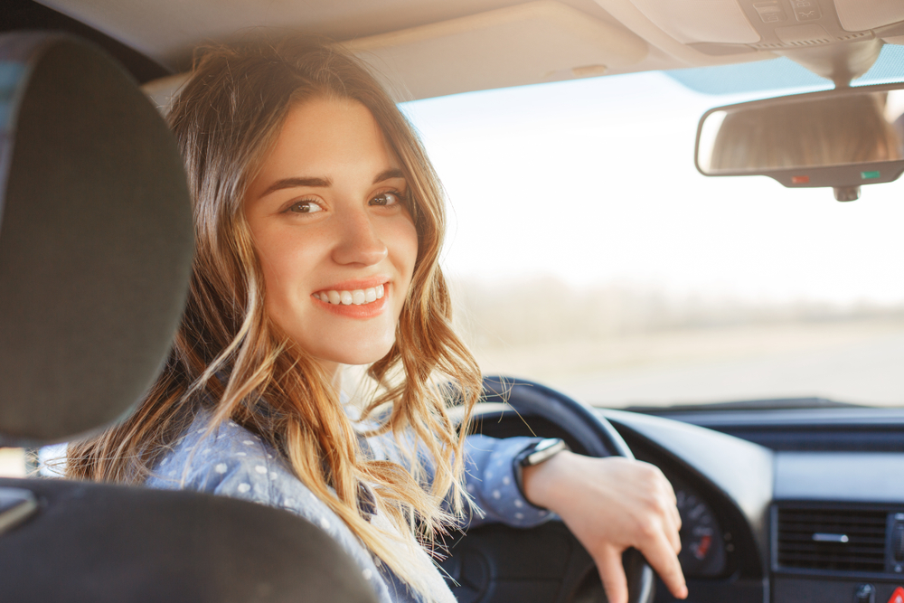 young lady driving a car